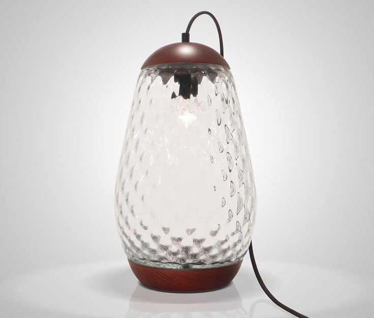 Mariana Costa e Silva has designed the Jar Lamp, a simple glass and wood table l...