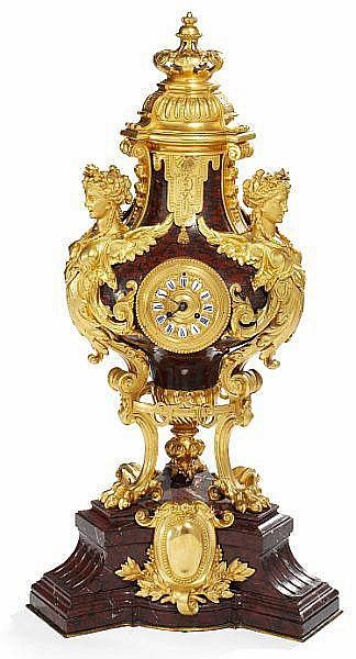 A large Napoleon III gilt bronze and red marble vase shaped