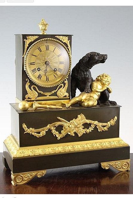 Empire style bronze and ormolu mantel clock surmounted with hound and sleeping c...