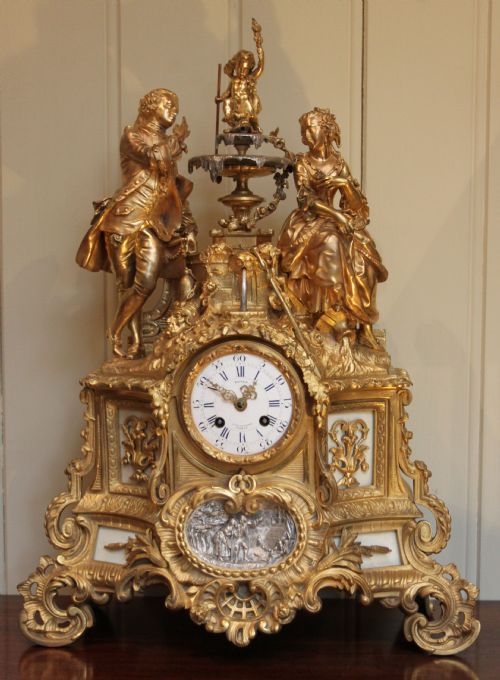 Exquisite detail of French gilt ormolu mantel clock...