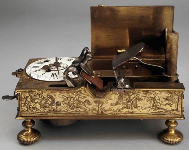 18th Century alarm clock. When the alarm goes on a flintlock is fired which ligh...