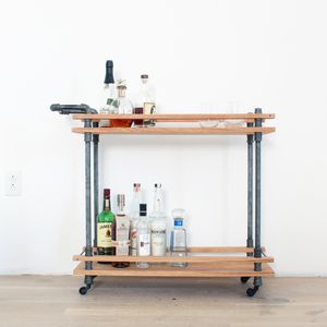 This DIY Bar Cart is made from oak boards and iron plumbers pipe and has a nice ...