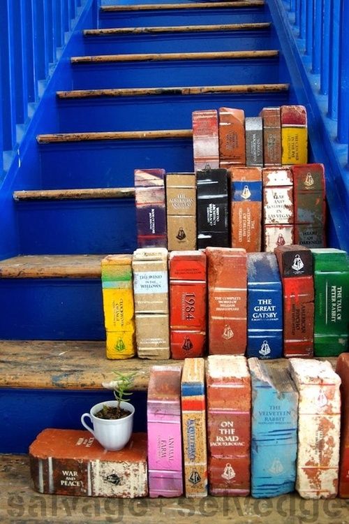 paint old bricks to look like books for your garden