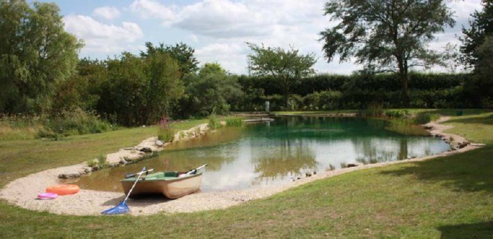 Convert a pond into a swimming pond. Mother Earth News says there are a few opti...