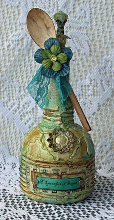 Love this beautiful altered bottle and she explains her technique on her blog....