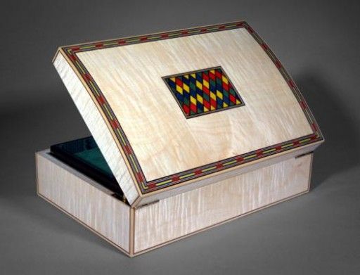 A domed top jewellery box veneered with figured maple - Fine Boxes