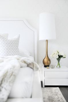 Major bedroom inspiration! Get the look with a tall gold lamp, white nightstand,...