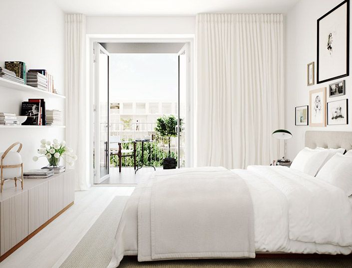 White and beige bedroom with a view