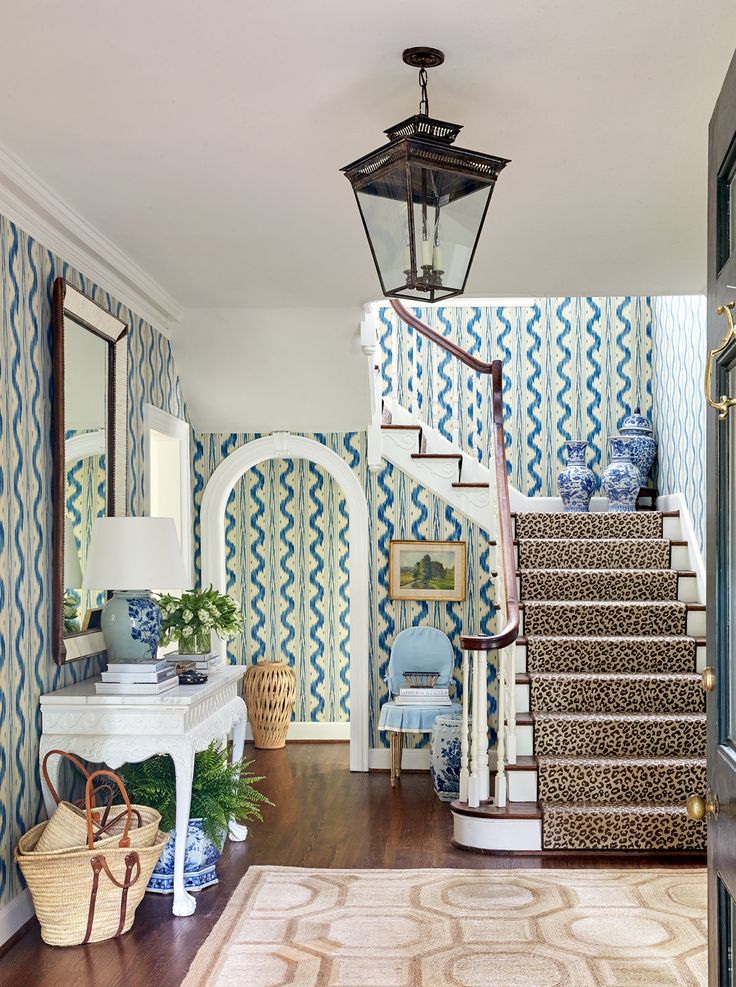 Colorful entryway with green and blue wallpaper