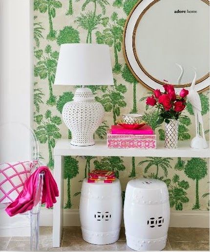 Large print green wallpaper, hot pink accessories, and blanc de chine accents lo...