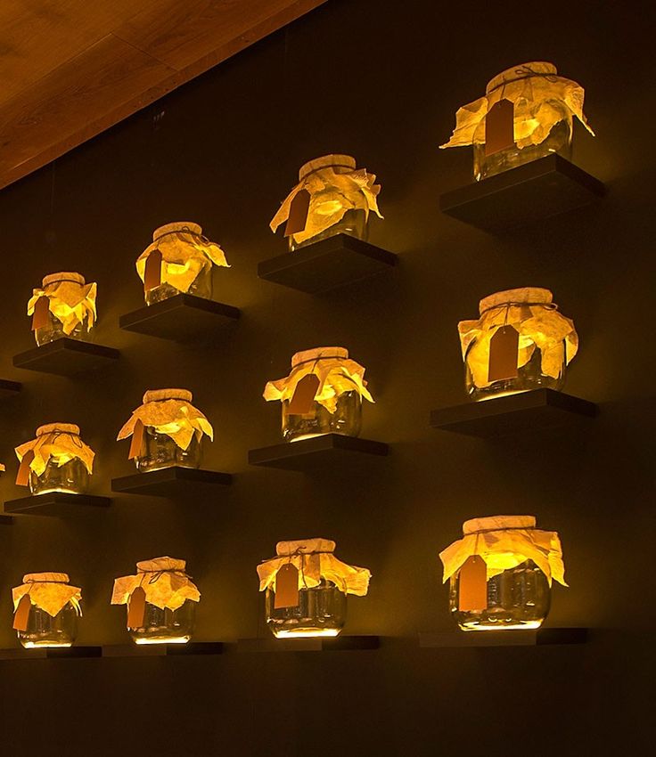 Design Detail – A Wall Of Uplit Glass Jars