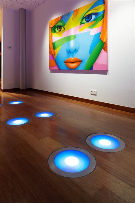 Embed lighting into your floors for an artistic touch.