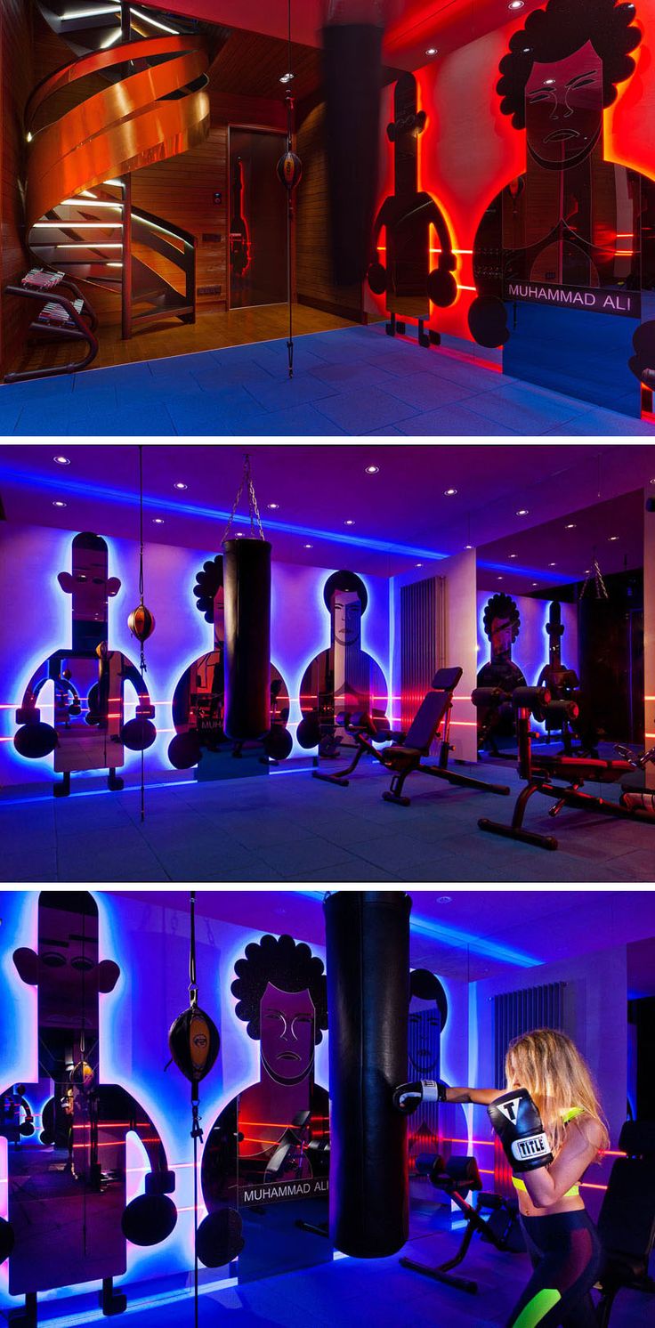 In this modern boxing gym there are custom-designed backlit mirrors are shaped l...