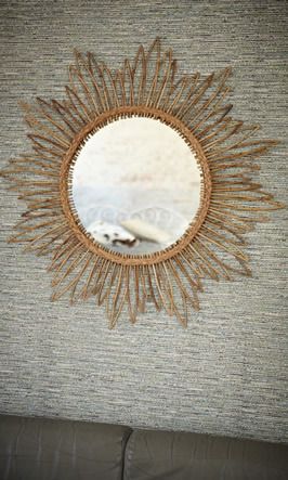 A new take on a classic -- bamboo and rush starburst mirror.