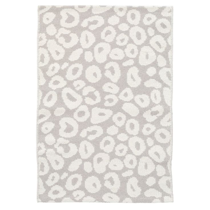 An ivory animal print on a soft grey backdrop makes this woven cotton rug a…