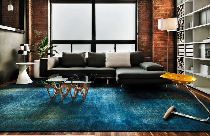 Blue overdyed rug in a modern living room 10 Rooms with Overdyed Rugs