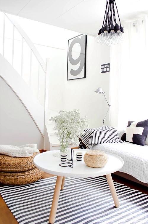 modern black and white living room with striped rug