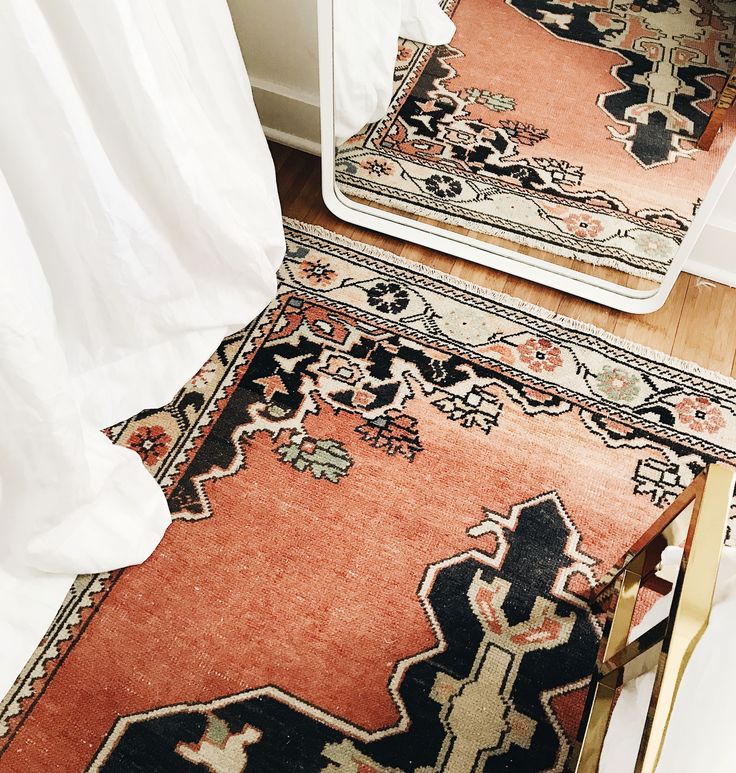 vintage turkish rug, modern floor mirror, white linen curtains from Barn & W...