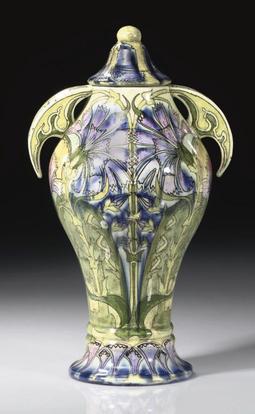 DISTEL - A DUTCH TWIN-HANDLED CERAMIC VASE AND COVER, CIRCA 1910.