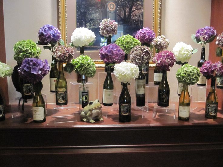 The combination of the beautiful hydrangea and wine bottles made for a perfect e...