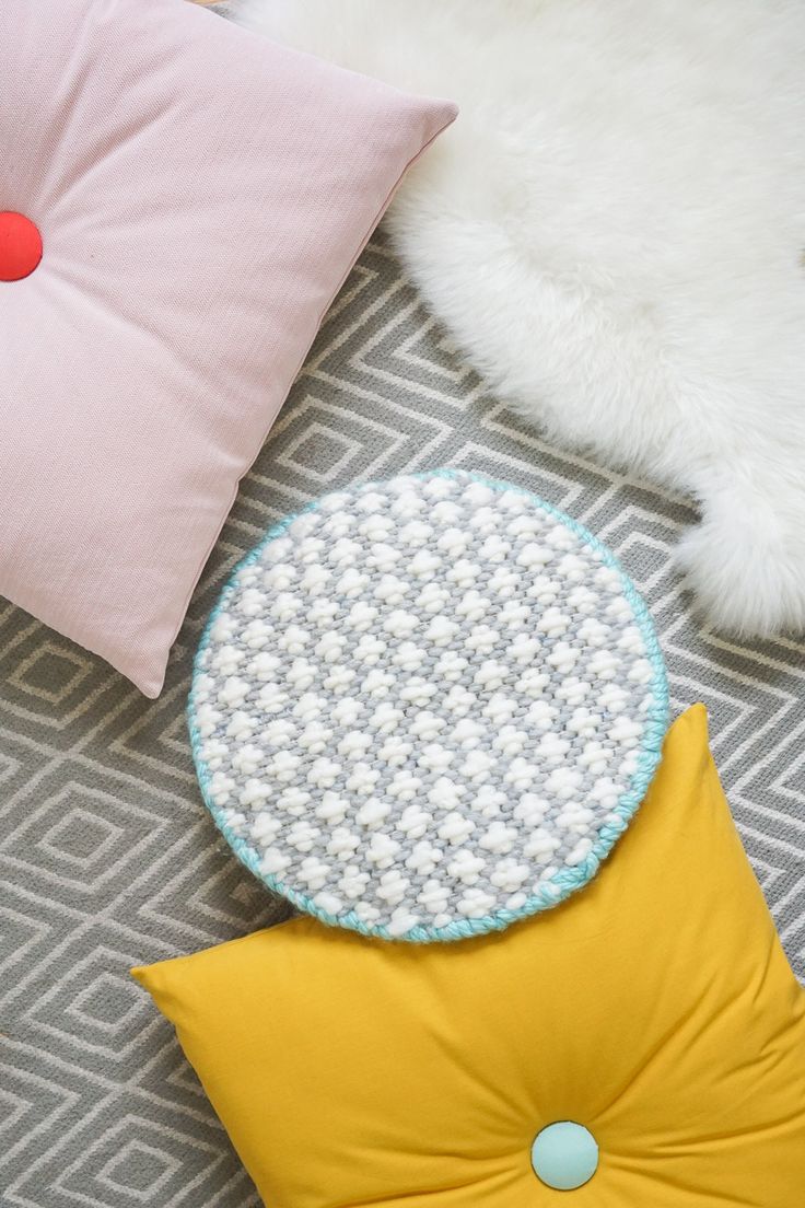 A modern DIY cross-stitched cushion to add texture to your home decor space! - s...