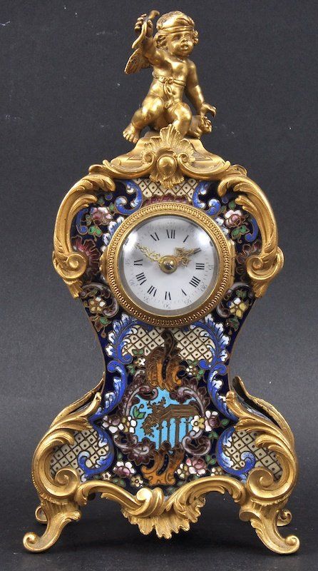 A 19th Century French Ormolu And Champleve Enamel Mantle Clock.