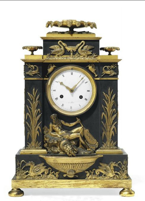 A DIRECTOIRE ORMOLU AND PATINATED BRONZE STRIKING MANTEL CLOCK LATE 18TH CENTURY