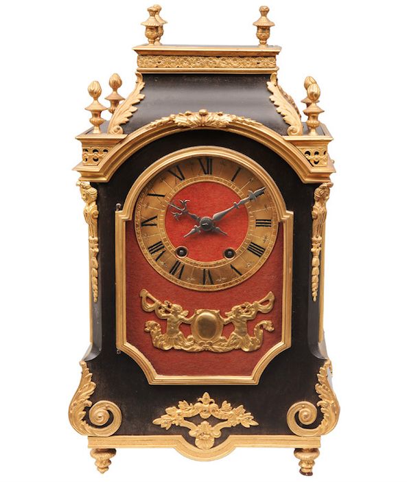 A french pendulum Lyon, end 19th cent. On three sides glazed case, wood ebonised...