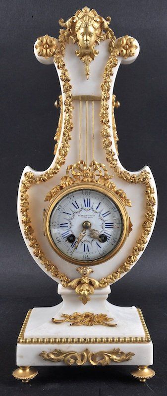 A Good 19th Century French White Marble Lyre Clock Retailed by Howell & Jones. =...