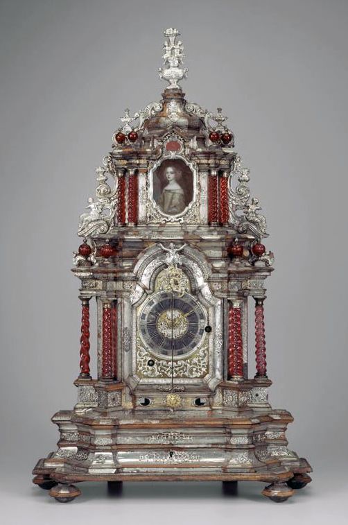 Table Clock with twisted columns and with a pendulum. Miniature of portrait of a...