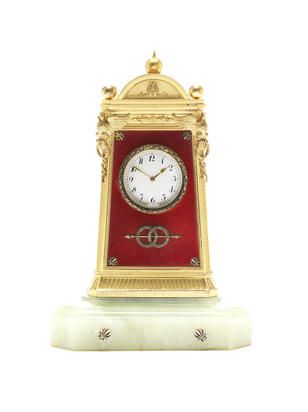 A silver-gilt, enamel and hardstone mantel clock by Fabergé workmaster Julius R...
