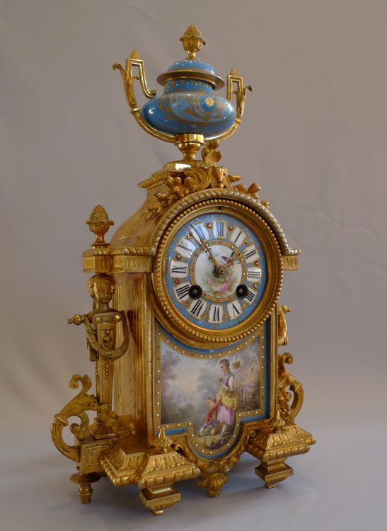 Antique mantel clock in ormolu and porcelain clock under dome.Achille Brocot