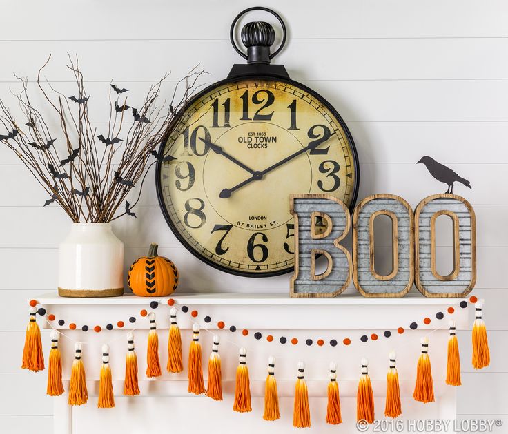 Create a spooktacular mantel by incorporating Halloween elements into your…