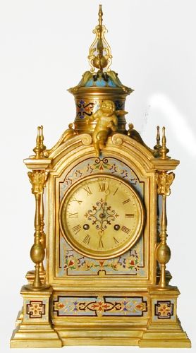 Tiffany & Co. champleve clock with cherubs.
