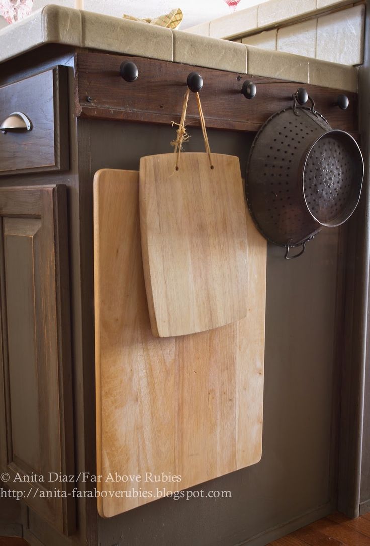Heavy, clunky kitchen tools, like cutting boards and colanders, fit awkwardly in...