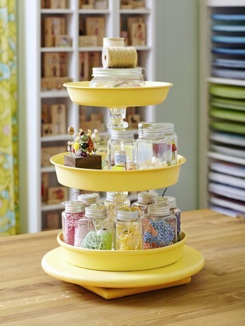 Use a lazy susan, clear glass candlesticks and round cake pans to make a great s...
