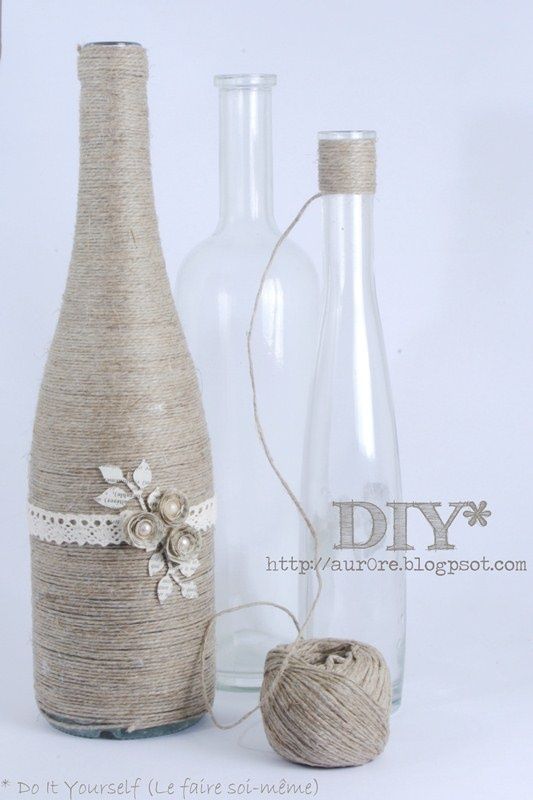 Creative use for wine bottles. Wrap with twine and add a few adornments.