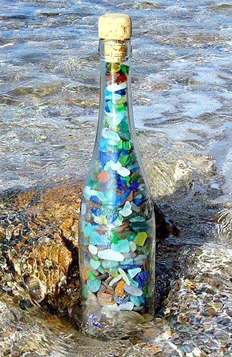 Decorative Bottle Idea: Fill a clear glass bottle with seaglass..., pebbles, and...