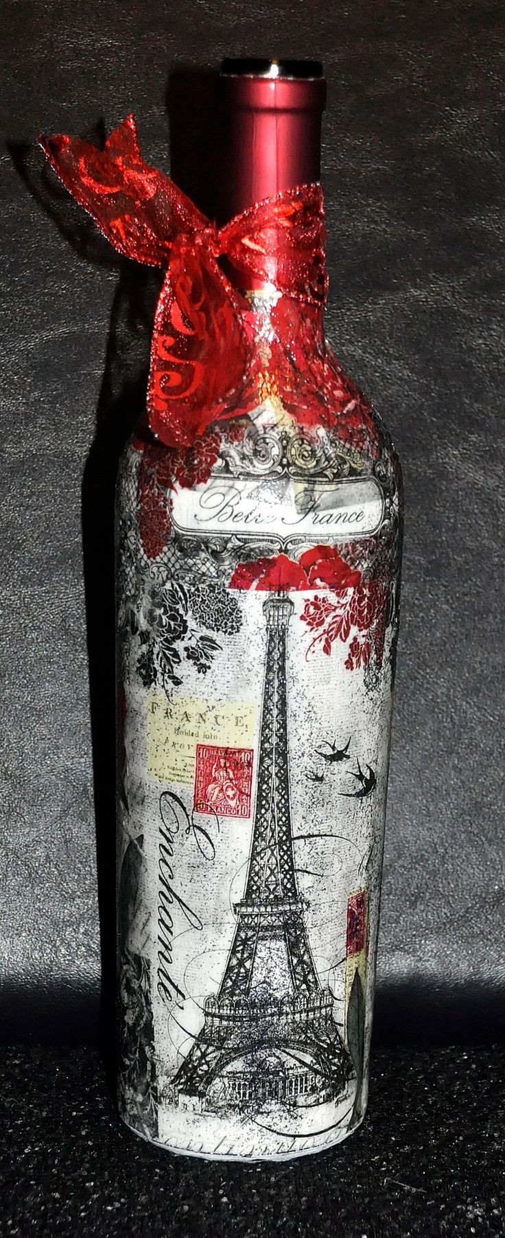 DIY...Take an old wine bottle or any bottle will do. Print out a printable photo...