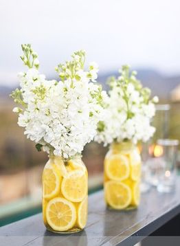 Lemons cut in half, change out the white flowers with fall colored ones and perf...
