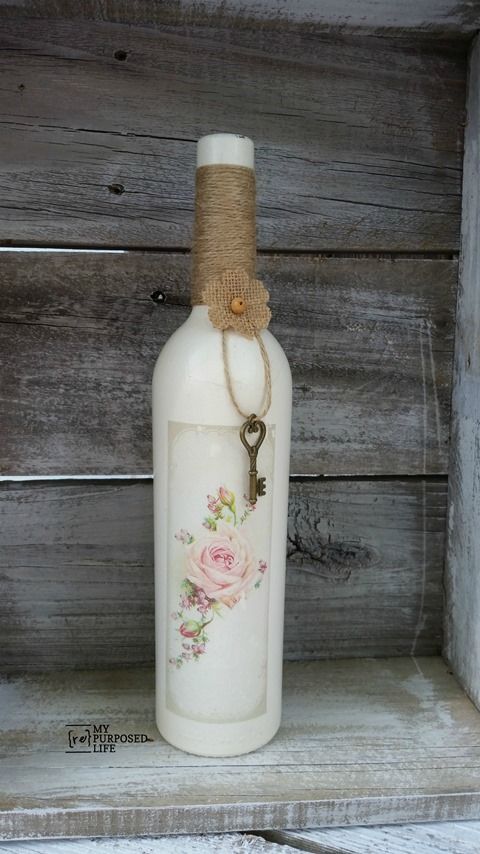 Repurpose some old wine bottles with some paint and an image transfer using Heir...