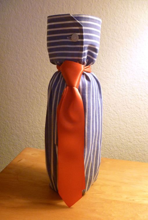 Wine bottle wrapped in shirt sleeve and tie....