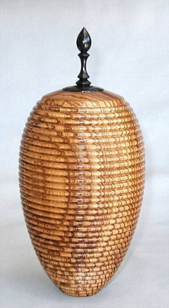 The grain pattern and beads give a sort of shimmering effect. 8 inches tall x 4 ...