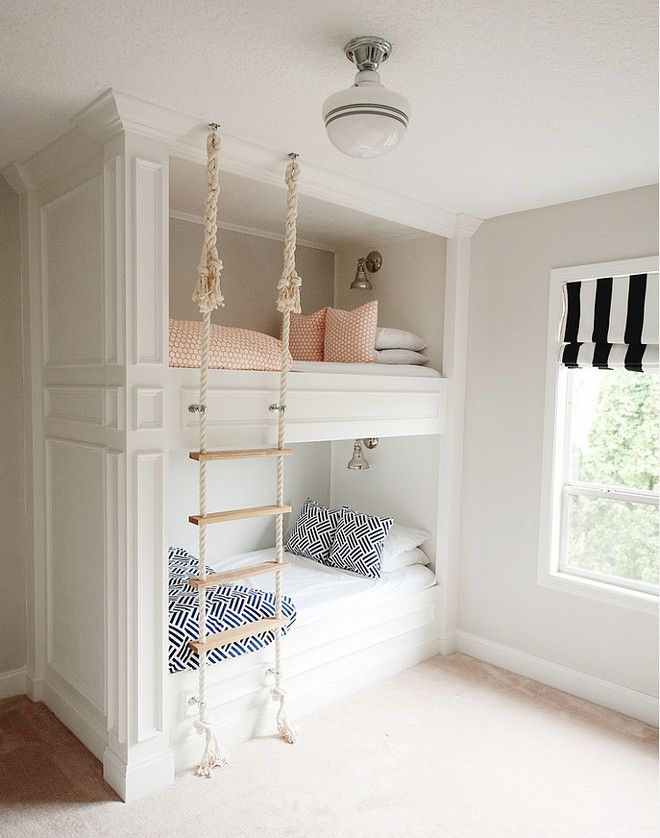 Bunk beds just got more fun in this darling children's room with a rope ladd...