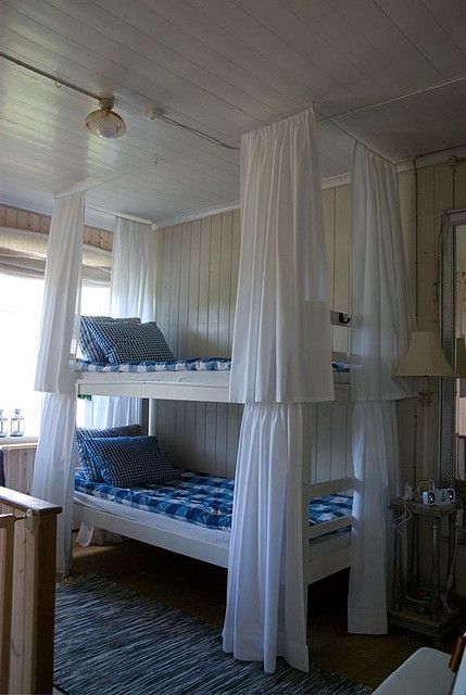 Love the curtains around each bunk bed. Gives each person the option of privacy.
