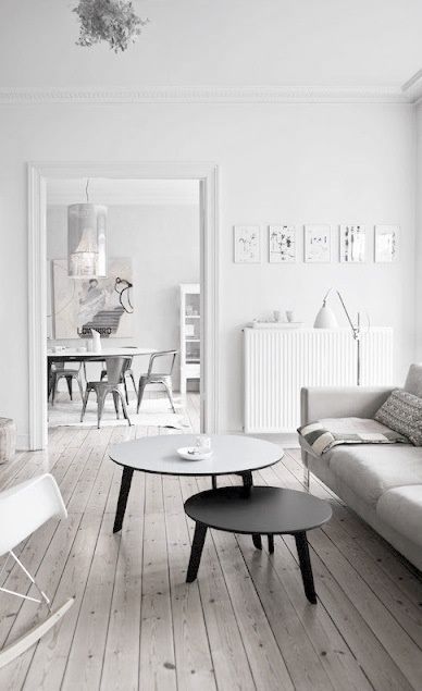 white living room black and grey round tables