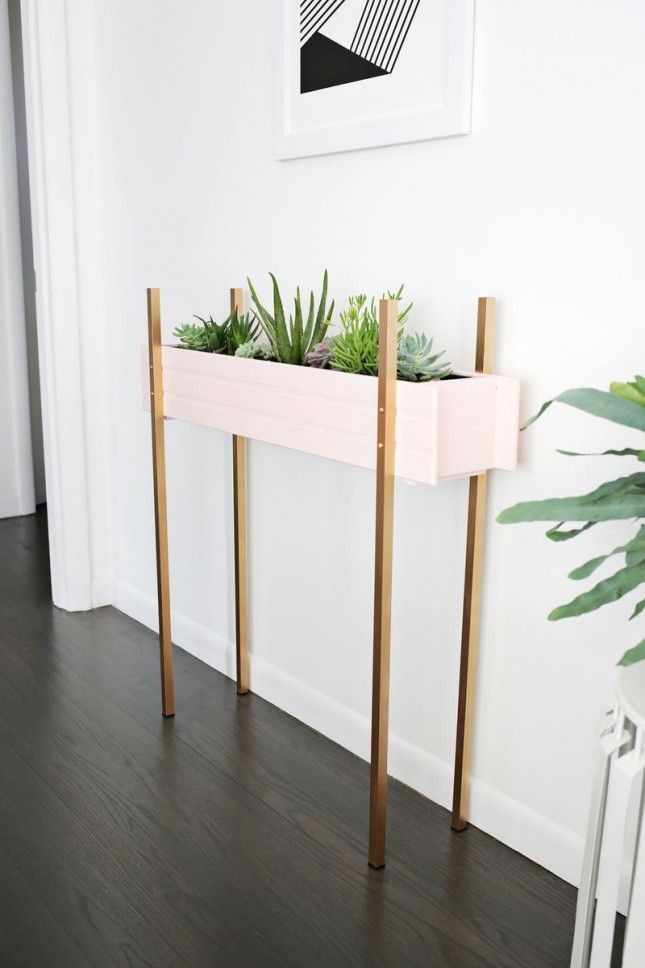 Add some green space to your foyer with this DIY skinny planter stand.