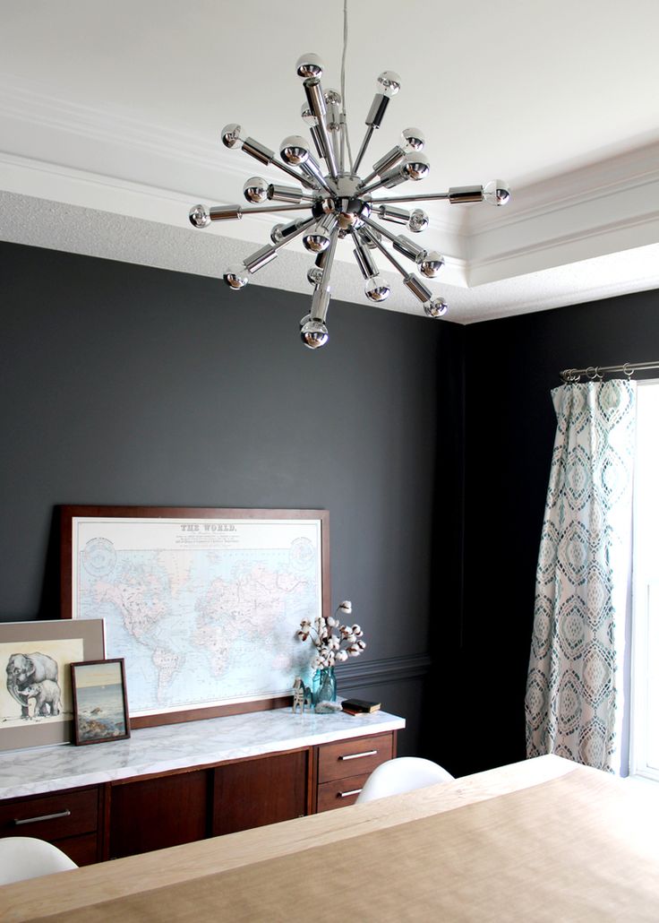 dark grey dining room with modern sputnik pendant light | tag&tibby...