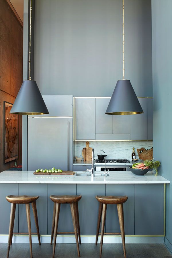 grey kitchen with metallic & wood details