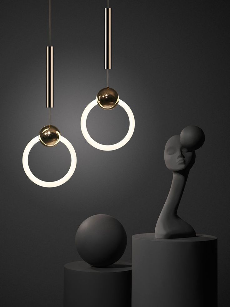 Ring Light By Lee Broom – A polished brass sphere, pierced by a dimmable circu...